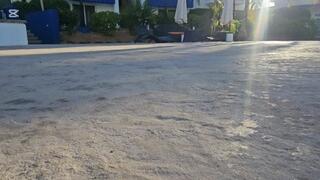 Milah Arches walking around the pool on sexy flip flops