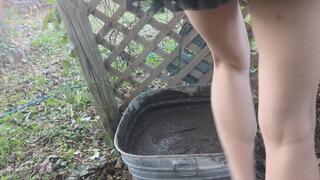 Fifi plays in her bin of mud and covers her legs in mud wearing brand new black strappy stiletto heels and a black mini skirt *NEW*