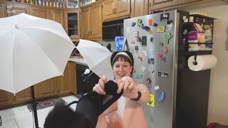 Woman dressing into shirt and tie and shorts