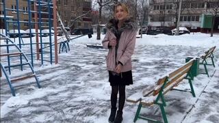 a girl plays on a summer playground in winter at -15 barefoot in stockings and a dress (reupload)