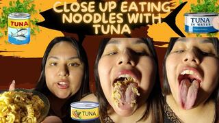 Close up eating noodles with tuna