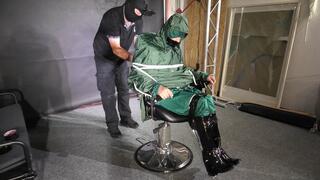 Marie M taped and gagged in shiny nylon rainwear