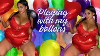 Playing with birthday balloons