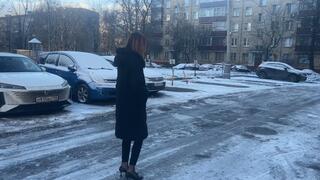 The girl went out for a walk in high heels, but she did not expect that it would be so slippery and there would be ice everywhere