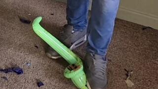 Tom pops some mini inflatables