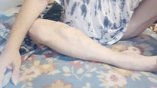 Up close flexing calves on bed