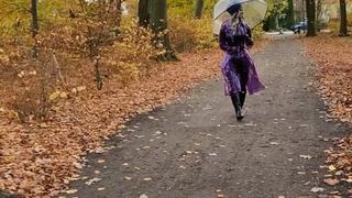 Rubbermissy Park stroll in purple rubber catsuit and shiny transparent PVC Rainmac raincoat