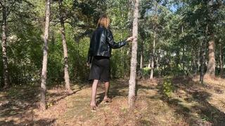 a girl in high heels was walking on a mountainous terrain and fell, she twisted her ankle and knee, it is very difficult for her to walk