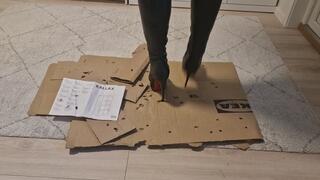 Leathana stomps and kicks cardboard