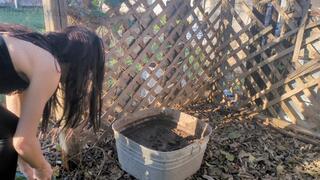 Fifi stepping into deep bin of mud and covering her clothes and body in mud *recent replay*