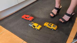 Giantess Raven Lee crushes uses 3 cars as stepping stones in big black chunky heels with painted toenails high right view