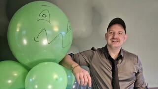Tom's destroys a tower of green balloons, no hand or foot popping allowed!