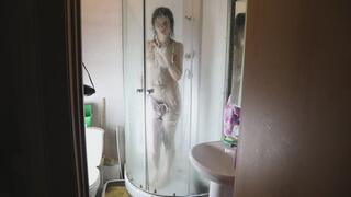 Lustful brunette fondles her holes in the shower