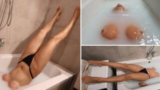 Jade holds her breath in a milky bathtub 4K