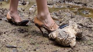 High heels wet and muddy, teddy bear crushed by high heels in mud, high heels muddy crush