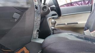 Angelin scratching his feet inside his new car (1)