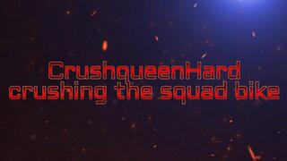 crush a quad toy bike in black nylons and hard soled sandals