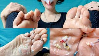 The Giantess goddess caresses tiny people with her feet in cream