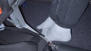 Amelie candidly filmed removing her sneakers onboard busy aircraft