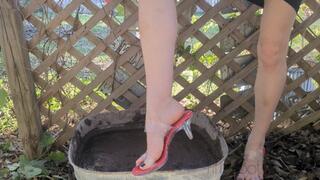 Fifi loses a brand new pair of sexy clear heels with red insoles into calf deep mud replay