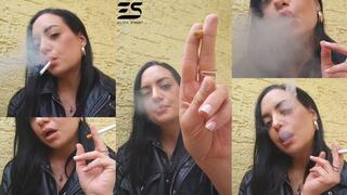 Outdoor smoke in a leather jacket