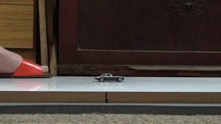 LIZZIE CRUSHES TWO METAL CARS IN FLAT SANDALS AND VINTAGE WEDGES