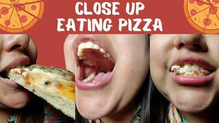 Close up eating pizza