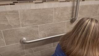 One big log in a public toilet from behind
