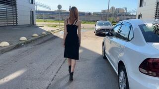 a girl in leather boots walks through puddles with dirty water, which quickly flows into the boots and makes them wet from the inside