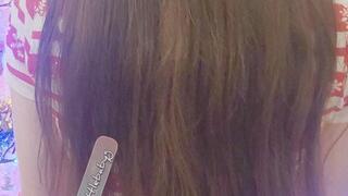 Littleforbig onesie wearing Tinylittlebabyg wiggles and looks at her book