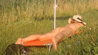 sun bathing , playing with ice on my belly and feet