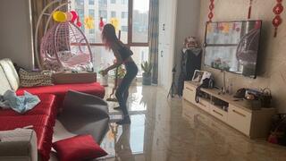 A girl in nylon socks tries to get out, but her socks slip on the floor