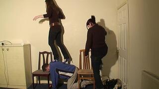 2 Girls Walking On The Human Bridge In High Heels