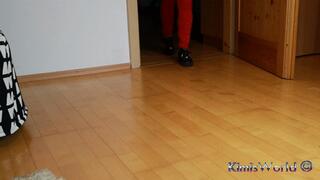 Red jeans and black sneakers