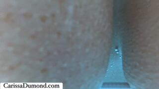 Carissa in the pool playing with the silicon banana dildo