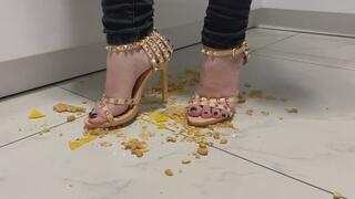 Marina crushes biscuits with her sexy high heel sandals
