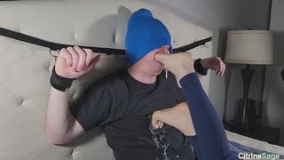 Foot slave bound to head board gags deeply on my feet