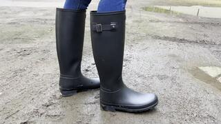 At her feet (Kahina in Hunter boots)