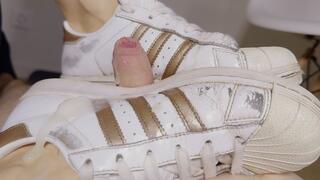 Shoejob with well-worn Adidas Superstar