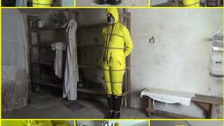 Captive woman in a yellow rain overalls tied up in a cellar
