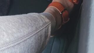 Driving in Orange Sandals Running Errands