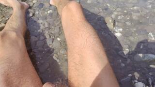 Public sunbathing naked in the river with a flaccid dick (avi)