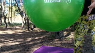 jump on green yogaball in forest