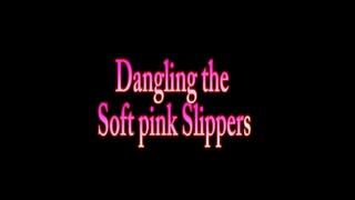Dangling the soft pink Slippers