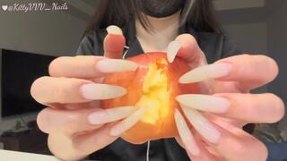 Filing my long claws and destroying a poor apple