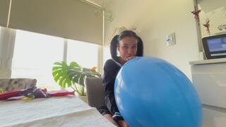 Akina blows up punch balloons in a sailor cosplay